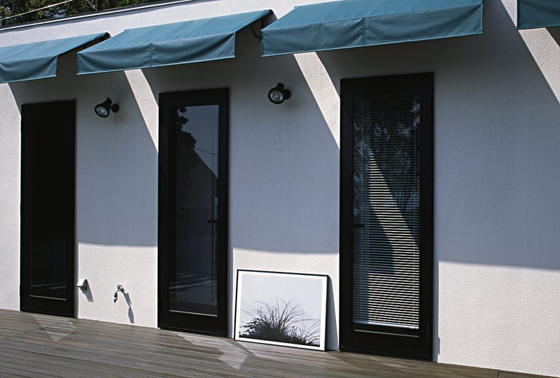 A framed monochrome print on the terrace